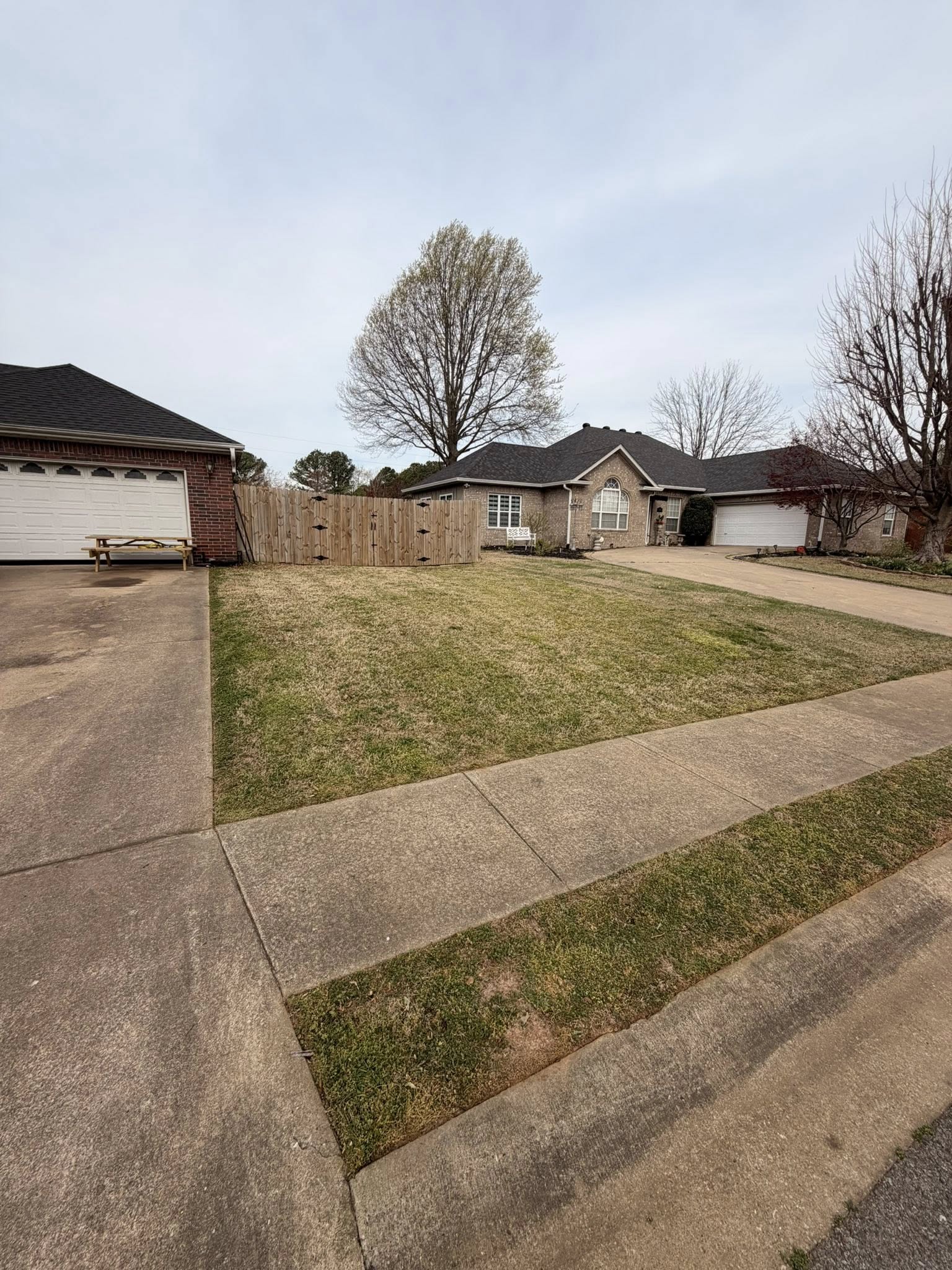 Trimmed lawn with landscaped beds NWA